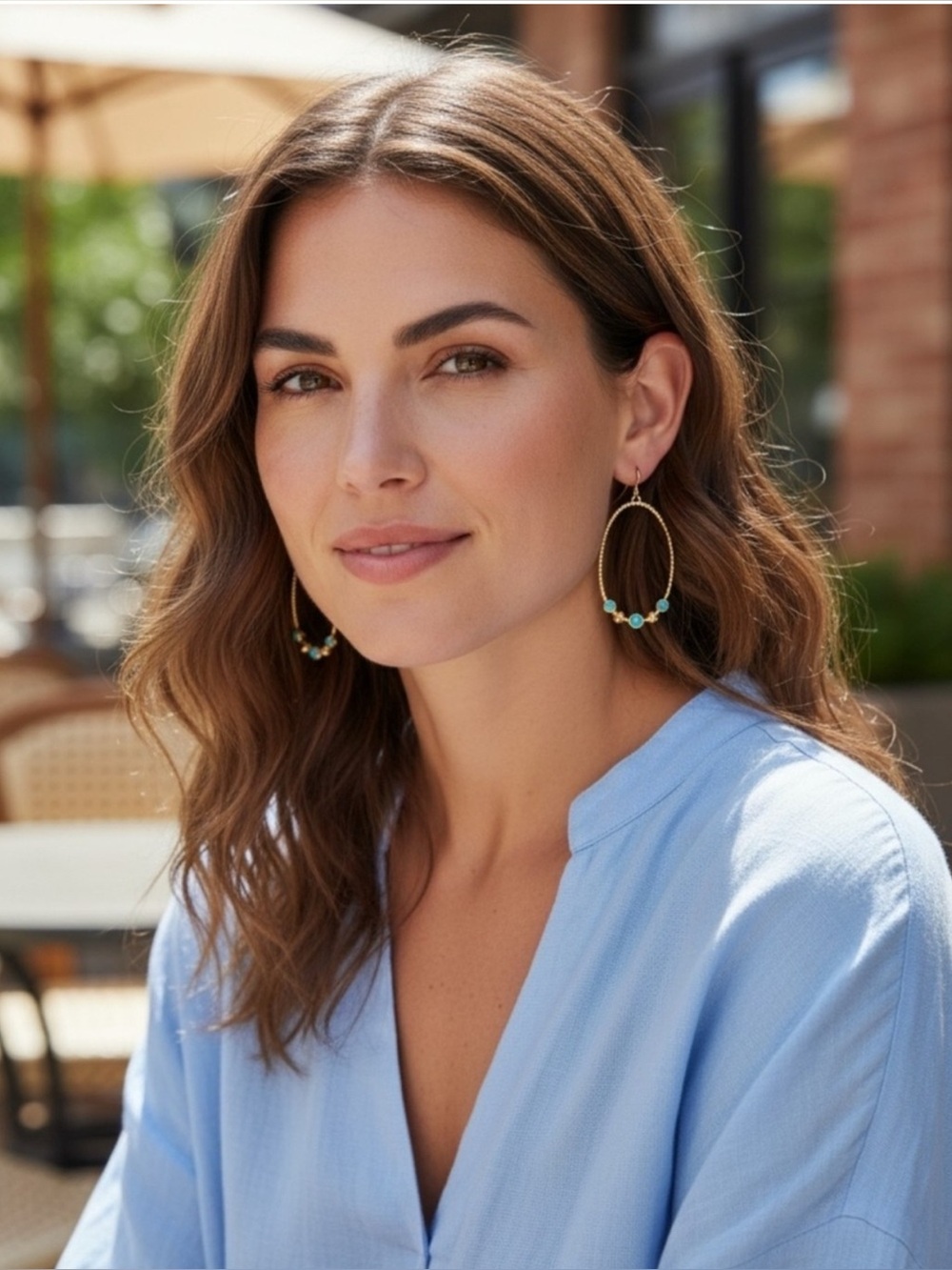 Plunder Gold Tone Twisted Hoop Earrings with Teal Green Accents